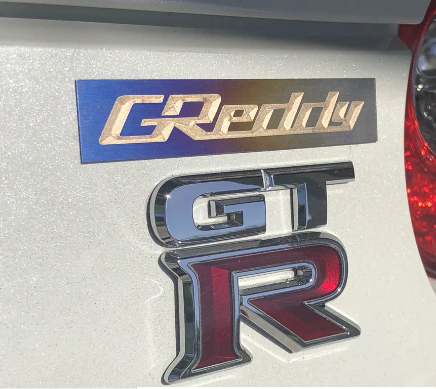 GReddy, GReddy Optional Titanium "GReddy" Emblem - (105x20mm)