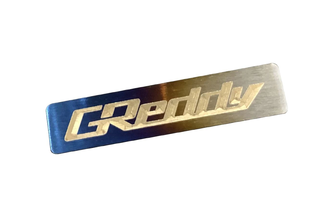 GReddy, GReddy Optional Titanium "GReddy" Emblem - (70x15mm)